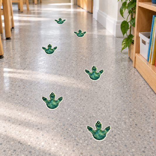 Classroom floor example with dinosaur track contour decals. Each decal is 4 x 4.27 in; packs contain 12 or 24 pieces.