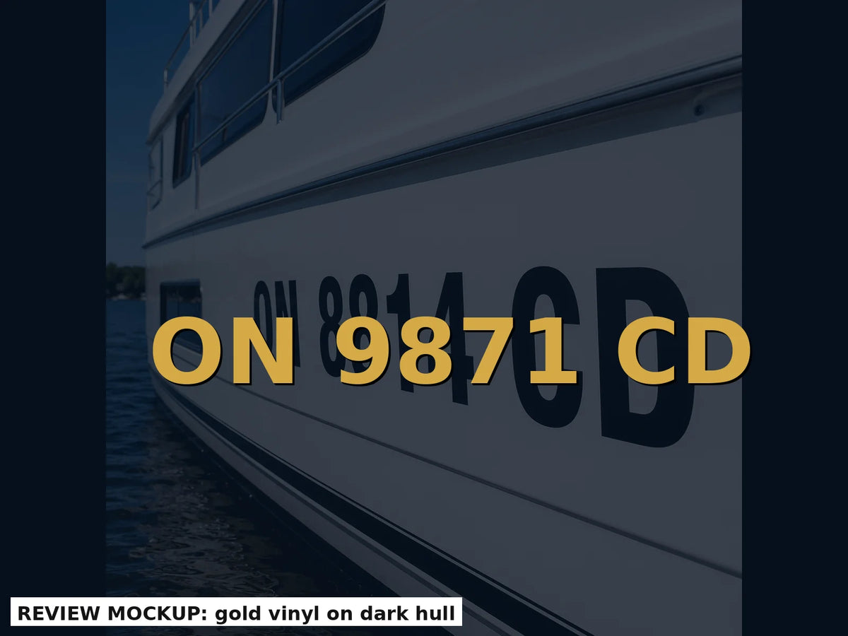 Gold vinyl boat registration numbers on a dark hull for high contrast