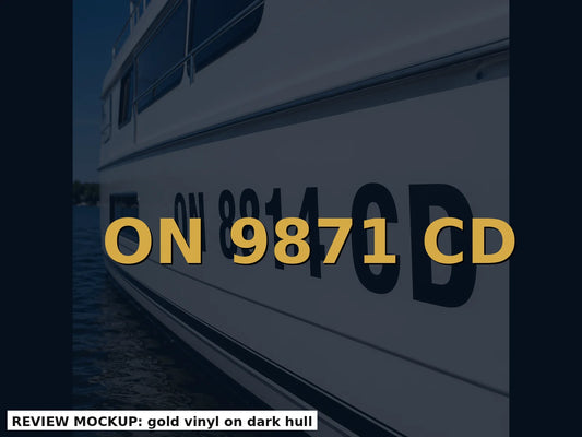 Gold vinyl boat registration numbers on a dark hull for high contrast