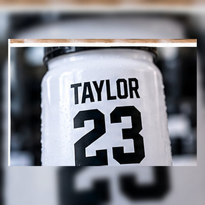 Close-up of a personalized player name and number on a bottle.