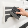 Applying commercial van lettering with a felt squeegee