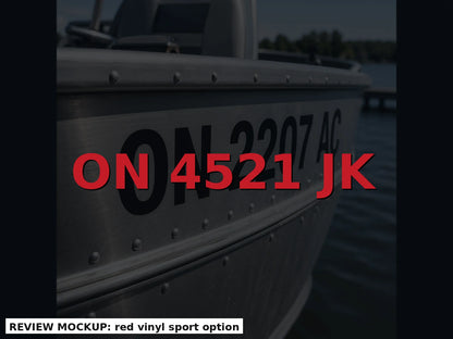 Red boat registration numbers on a dark hull, PCL display height