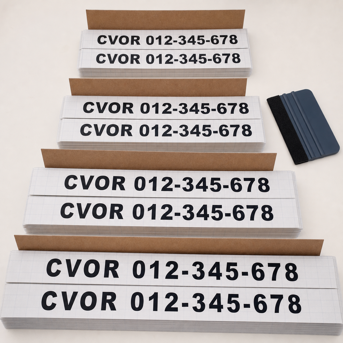Matched CVOR number-only door decal pairs organized for fleet-pack fulfilment