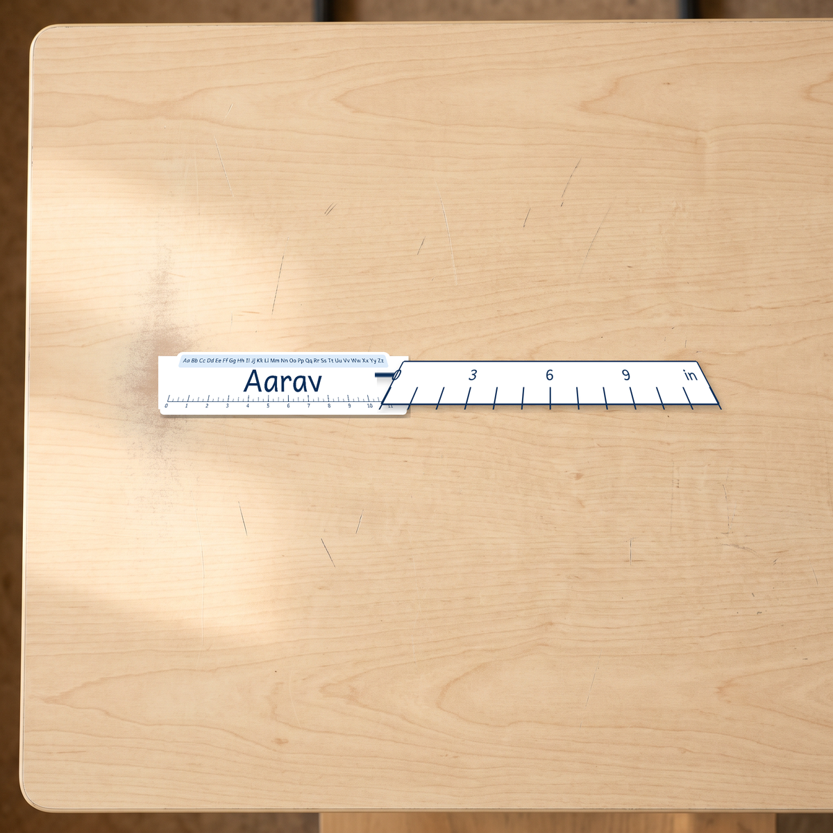 classroom desk name learning strips canada shown beside an inch ruler for scale