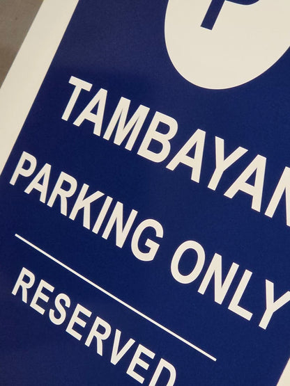 Close-up of custom parking sign showing professional vinyl print quality and rounded corners