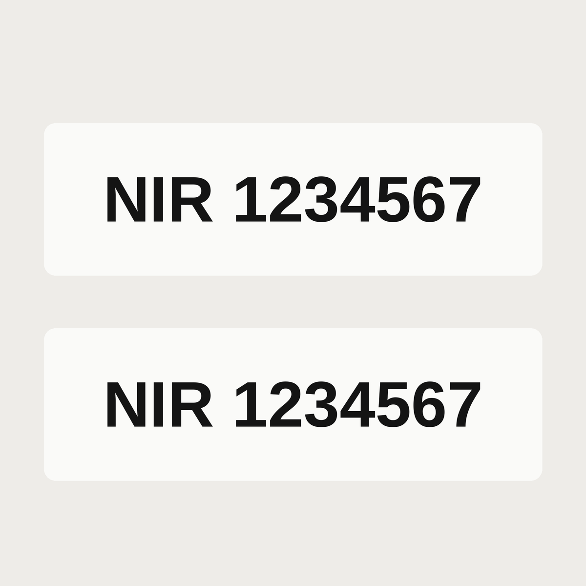 Pair of black NIR number decals on a white truck cab, example number