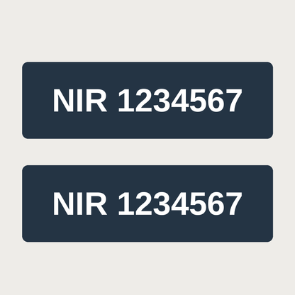 Pair of white NIR number decals on a dark truck cab, example number
